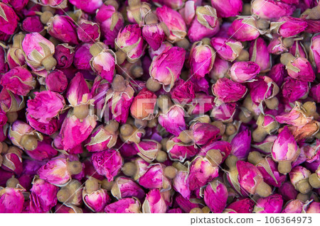 Dried rosebuds background texture closeup. Dried rosebuds background texture closeup. 106364973