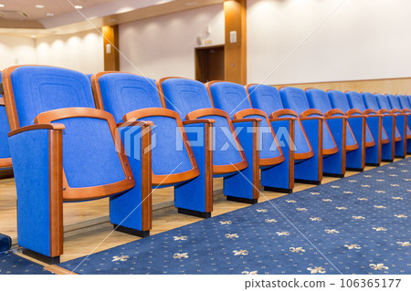Conference hall with blue seats 106365177