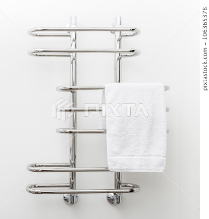 Modern bathroom towel dryer on white wall background Modern bathroom towel dryer on white wall background 106365378