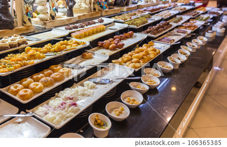 Variety of desserts of eastern countries style in hotel 106365385