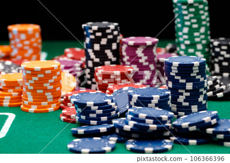 Stacks of playing chips on casino table Stacks of playing chips on casino table 106366396