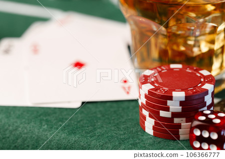 Cards, playing chips and alcohol in glass 106366777