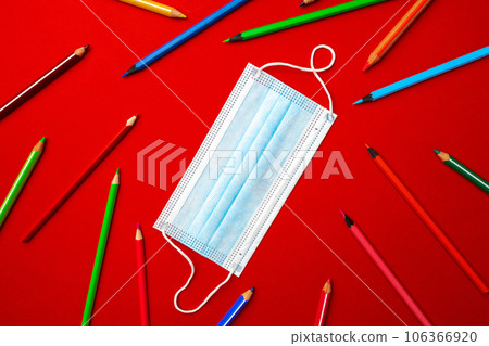 Colorful pencils and medical face mask. Pandemic education concept 106366920