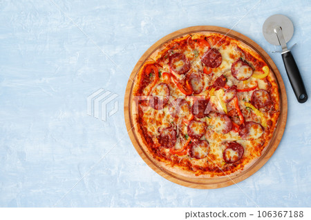 Delicious pizza with sausages on gray background 106367188