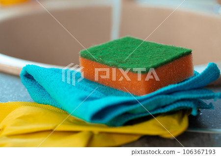 Cleaning sponge and rag on kitchen counter 106367193