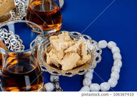 Halva dessert with tea cup on blue background 106367410