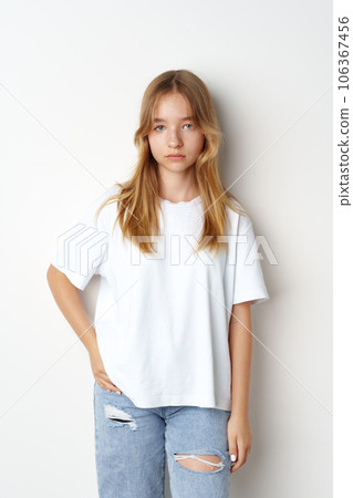 Portrait of young beautiful cute teen girl posing at camera Portrait of young beautiful cute teen girl posing at camera 106367456