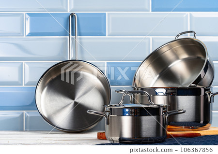 Set of aluminum cookware on kitchen counter 106367856