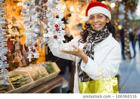 Latin woman at christmas fair 106368316