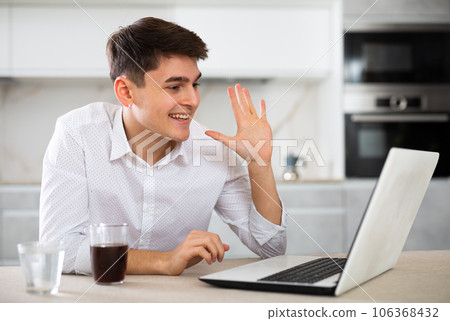 man working on laptop 106368432