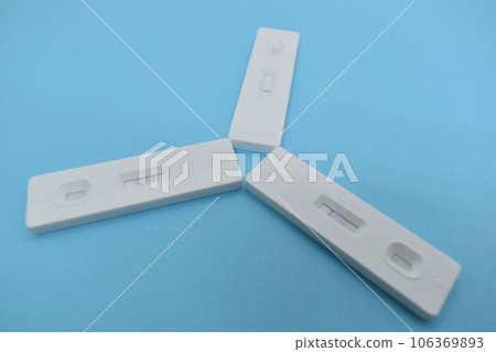 covid test kit on blue background 106369893