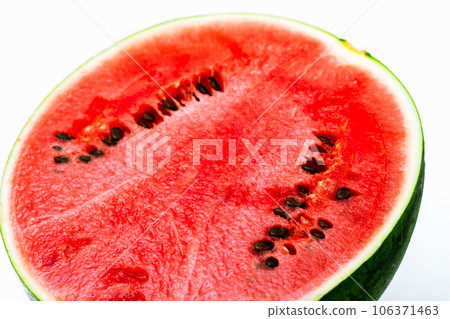 Fresh watermelon with white background 1/2 cut left facing vivid Fresh watermelon with white background 1/2 cut left facing vivid 106371463