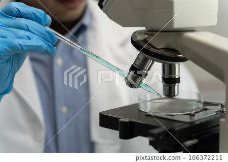 science testing substances biochemical research scientist working in a science lab Analyzing Test 106372211