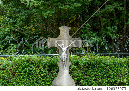 jesus in graveyard with barbed wire 106372975