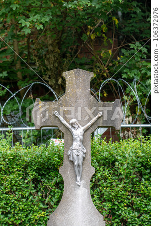 jesus in graveyard with barbed wire 106372976