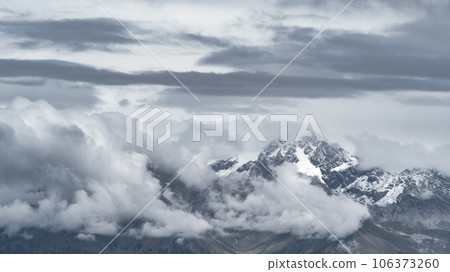 Gray mountain landscape com clouds 106373260