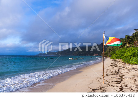 Coastal landscape with the flag of Seychelles 106373438