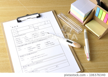 Medical questionnaire, sticky notes, and thermometer Medical questionnaire, sticky notes, and thermometer 106376340