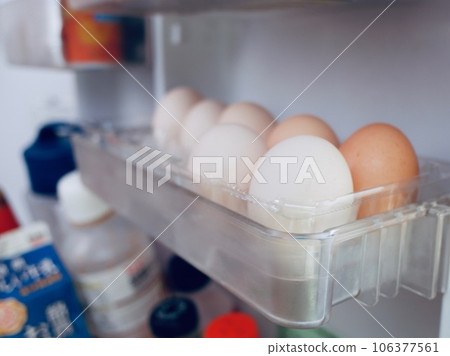 Eggs lined up in the refrigerator Eggs lined up in the refrigerator 106377561