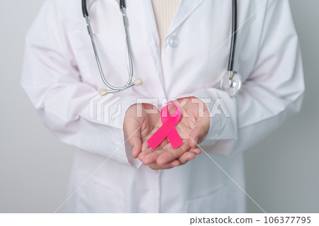 Pink October Breast Cancer Awareness month, doctor with pink Ribbon in hospital for support people life and illness. National cancer survivors month, Mother and World cancer day concept Pink October Breast Cancer Awareness month, doctor with pink Ribbon in hospital for support people life and illness. National cancer survivors month, Mother and World cancer day concept 106377795