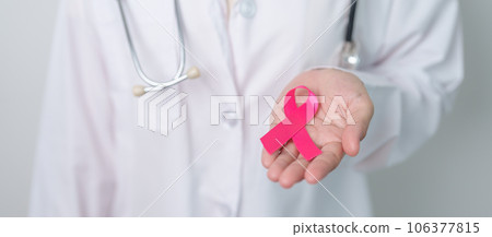 Pink October Breast Cancer Awareness month, doctor with pink Ribbon in hospital for support people life and illness. National cancer survivors month, Mother and World cancer day concept Pink October Breast Cancer Awareness month, doctor with pink Ribbon in hospital for support people life and illness. National cancer survivors month, Mother and World cancer day concept 106377815