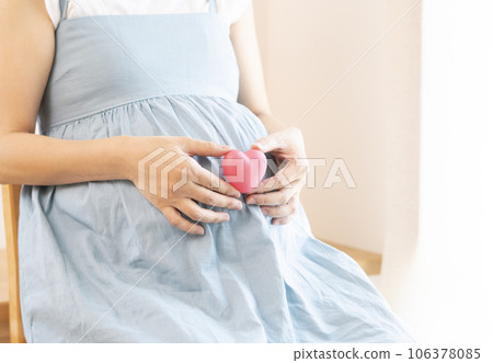 pregnant woman with heart pregnant woman with heart 106378085