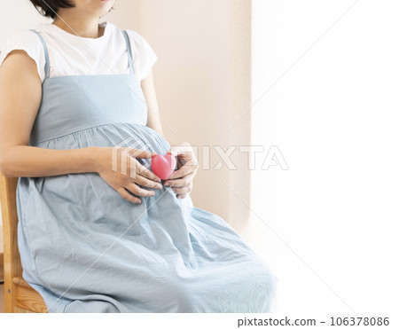 pregnant woman with heart pregnant woman with heart 106378086