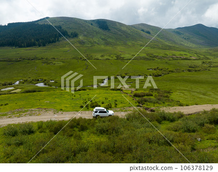 Car road trip on the high altitude mountain trail, China 106378129