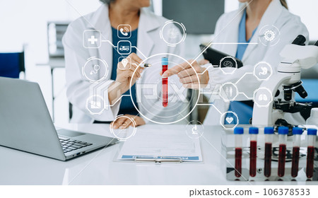Scientist two woman with tablet and laptop, laboratory and ecofriendly science. Agriculture, research and scientists with online reading, test samples for global warming, analytics and tech.. Scientist two woman with tablet and laptop, laboratory and ecofriendly science. Agriculture, research and scientists with online reading, test samples for global warming, analytics and tech.. 106378533