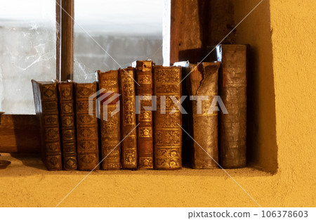 Old books on a row Old books on a row 106378603