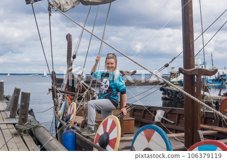 tourist aboard a modern replica of ancient viking longship tourist aboard a modern replica of ancient viking longship 106379119
