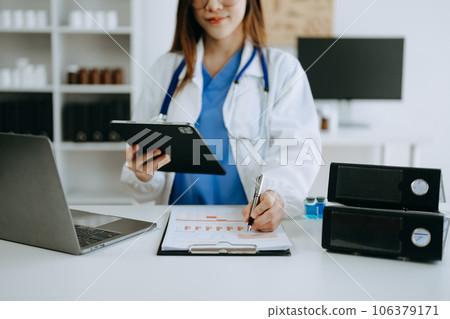 Medicine doctor hand working with modern digital tablet computer interface as medical network concept in office Medicine doctor hand working with modern digital tablet computer interface as medical network concept in office 106379171