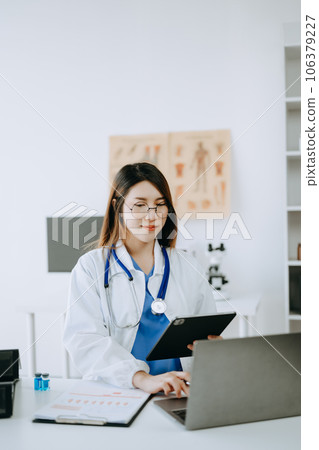 Medicine Asian doctor hand working with modern digital tablet computer interface as medical network concept 106379227