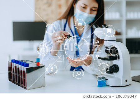 DNA molecule testing concepts. The doctor in a mask examines DNA molecules on the chemical laboratory with vr icon... DNA molecule testing concepts. The doctor in a mask examines DNA molecules on the chemical laboratory with vr icon... 106379347