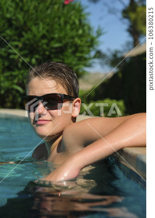 Portrait of a boy in a swimming pool 106380215