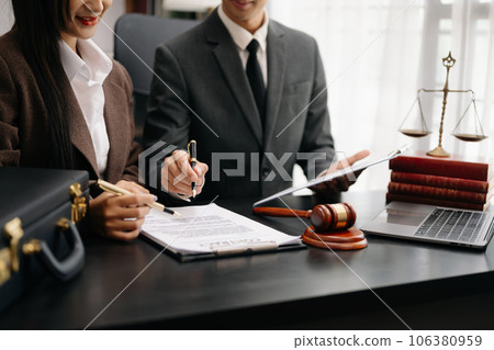 business people and lawyers discussing contract papers sitting at the table. Concepts of law, advice, legal services. in morning light. 106380959
