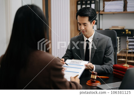 Asian Business law concept, Lawyer business lawyers are consulting lawyers for women entrepreneurs to file copyright lawsuit with laptop and tablet at office . 106381125