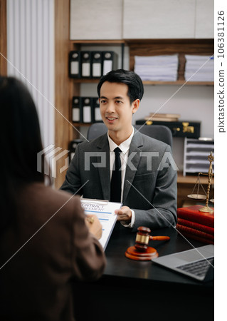 Asian Business law concept, Lawyer business lawyers are consulting lawyers for women entrepreneurs to file copyright lawsuit with laptop and tablet at office . 106381126