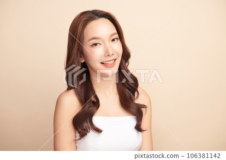 Beautiful young asian woman with clean fresh skin on beige background, Face care, Facial treatment, Cosmetology, beauty and spa, Asian women portrait. 106381142