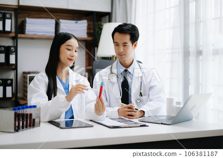 Medical technology network team meeting concept. Asian Doctor hand working with smart phone modern digital tablet and laptop computer with graphics chart interface, Medical technology network team meeting concept. Asian Doctor hand working with smart phone modern digital tablet and laptop computer with graphics chart interface, 106381187