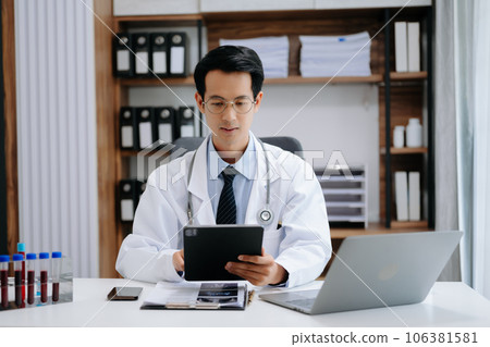Medical technology concept. Asian Doctor working with mobile phone and stethoscope in modern office 106381581