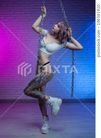 sexy girl in white underwear with metal chains in neon light sexy girl in white underwear with metal chains in neon light 106381910