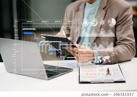Project manager working and update tasks with milestones progress planning and Gantt chart scheduling diagram. business working with smart phone, tablet and laptop in office.. Project manager working and update tasks with milestones progress planning and Gantt chart scheduling diagram. business working with smart phone, tablet and laptop in office.. 106381937