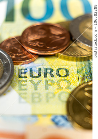 Euro money, paper banknotes and coins close-up macro Euro money, paper banknotes and coins close-up macro 106382289