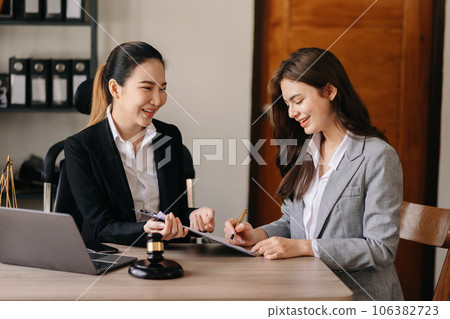 .Asian business and Male lawyer or judge consult having team meeting with client, Law and Legal services concept.Customer service good cooperation in office .Asian business and Male lawyer or judge consult having team meeting with client, Law and Legal services concept.Customer service good cooperation in office 106382723