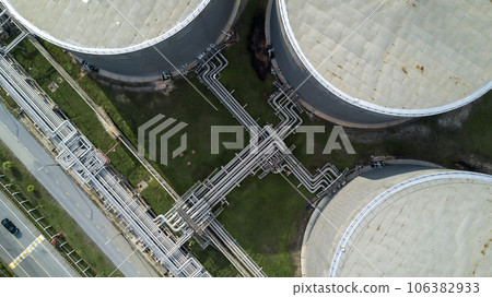 Aerial view liquid chemical tank terminal, Storage of liquid chemical and petrochemical products tank, Oil and gas storage tanks at industrial oil refinery. Aerial view liquid chemical tank terminal, Storage of liquid chemical and petrochemical products tank, Oil and gas storage tanks at industrial oil refinery. 106382933