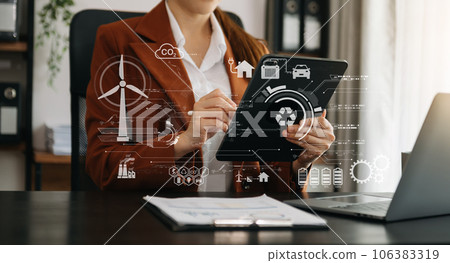 ESG concept of environmental, Green ethical business preserving resources, reducing CO2, Business person team working on laptop virtual smartphone to reduce CO2 emissions carbon . 106383319