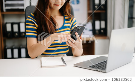 businesswoman hand working with new modern computer and writing on the notepad strategy diagram as concept . businesswoman hand working with new modern computer and writing on the notepad strategy diagram as concept . 106383563