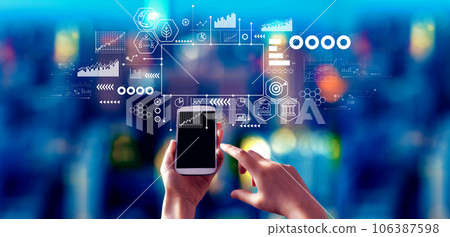 Eco theme with person using a smartphone at night Eco theme with person using a smartphone at night 106387598