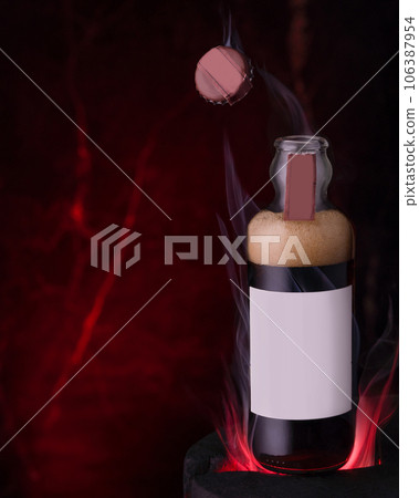 A bottle of coke stands on the fire and the lid flies away. A bottle of coke stands on the fire and the lid flies away. 106387954